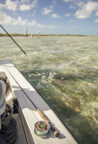 Fly fishing for bonefish from a flats skiff.