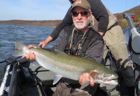 Fly fishing for huge Naknek rainbow trout at Rapids Camp Lodge
