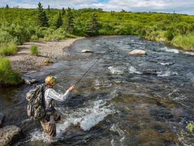 Fly fishing at Rapids Camp Lodge by Abe Blair