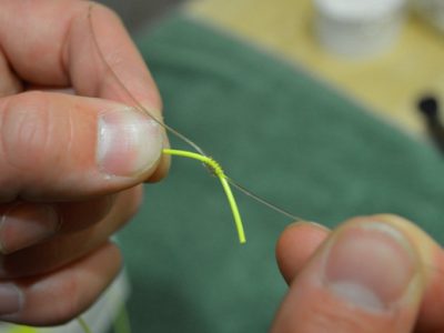 Tying nail knots.