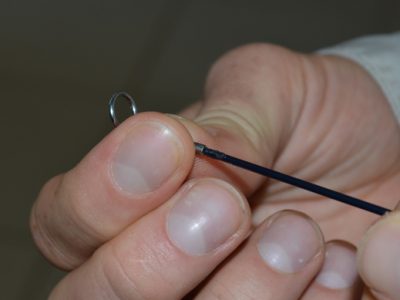 How to repair a broken fishing rod tip top in the field.