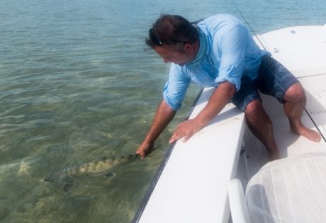 Releasing a big bonefish from Andros South by Ryan Durkin.