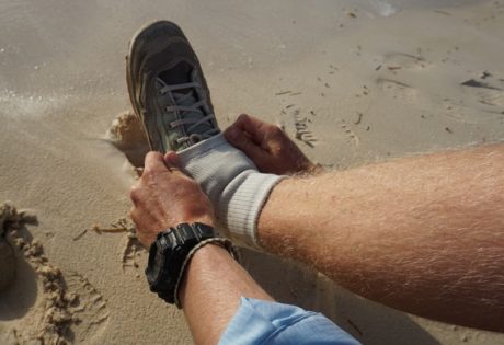 Keeping sand out of wading boots.