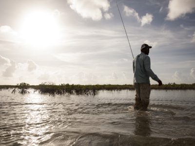 Wading for bonefish by Hollis Bennett