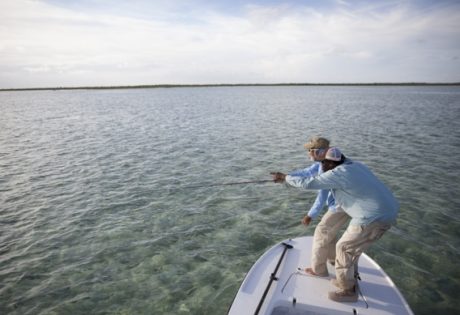 Pointing out bonefish by Hollis Bennett