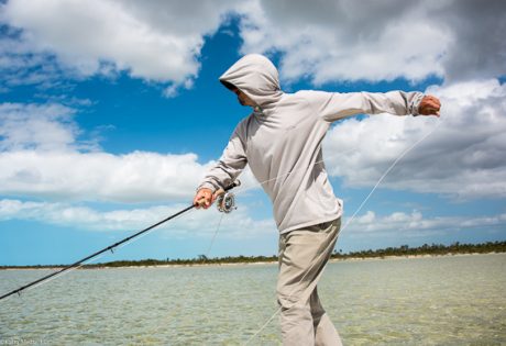 Grant Turner setting the hook on a bonefish by Bill Kalm